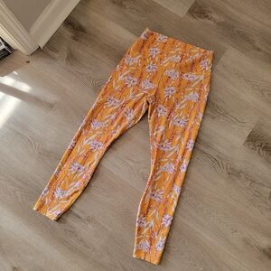 Fabletics Yellow and Pink Floral Leggings Size Medium.